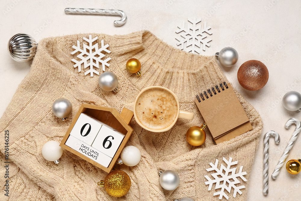 Christmas composition with cup of coffee and cube calendar on beige background