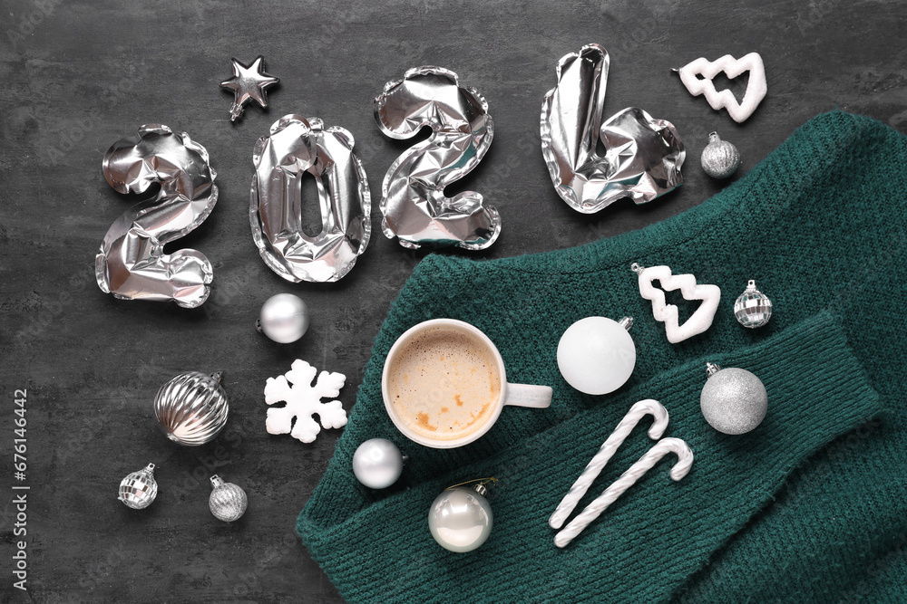 Beautiful composition with cup of coffee and Christmas decor on black background