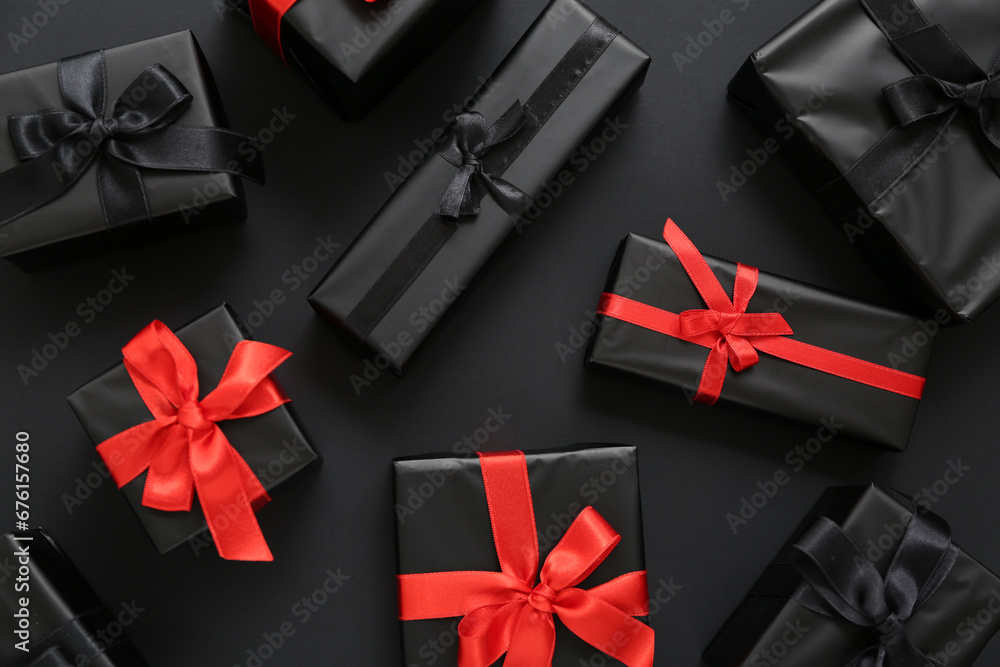 Many gift boxes on dark background. Black Friday