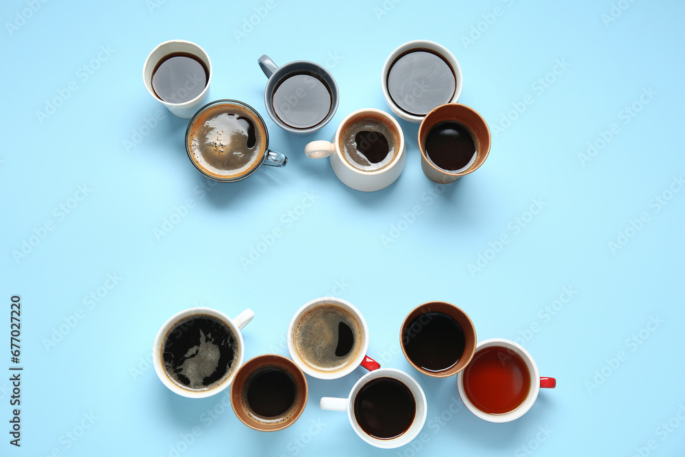 Many cups of hot coffee on blue background