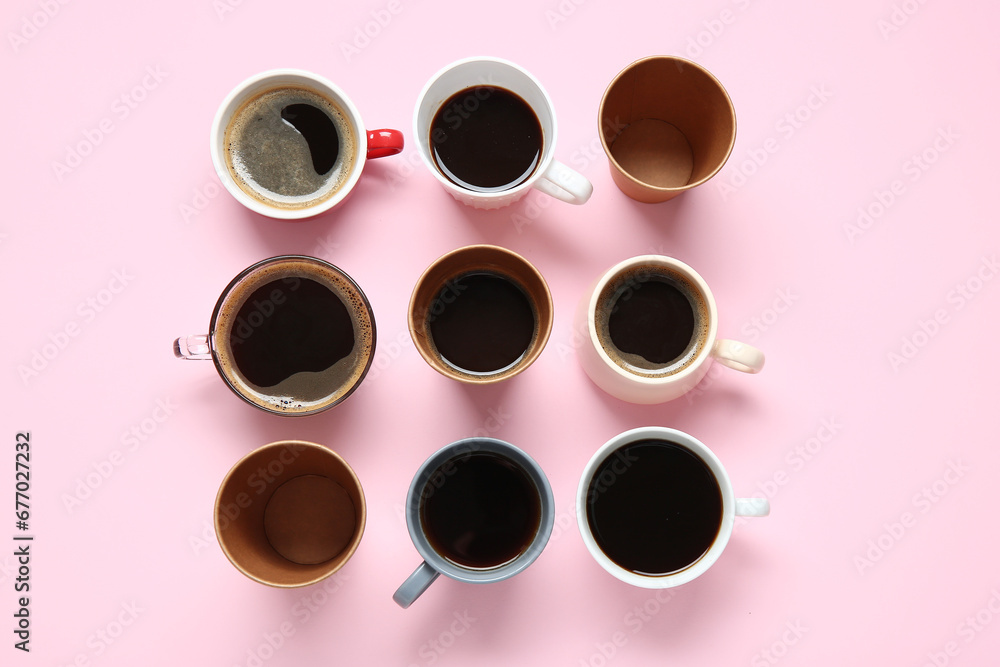 Many cups of hot coffee on pink background