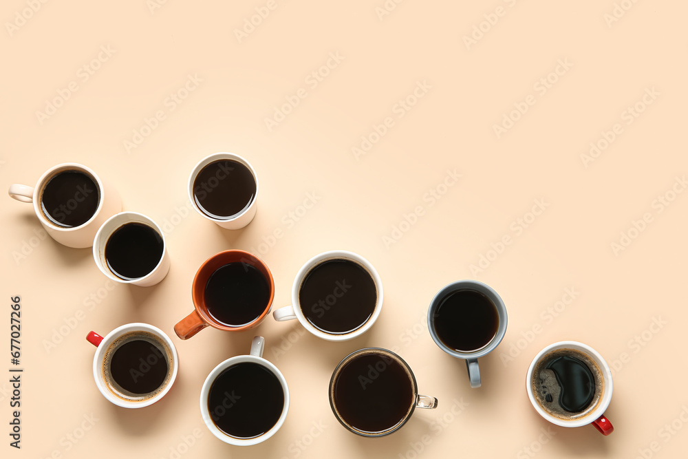 Many cups of hot coffee on beige background