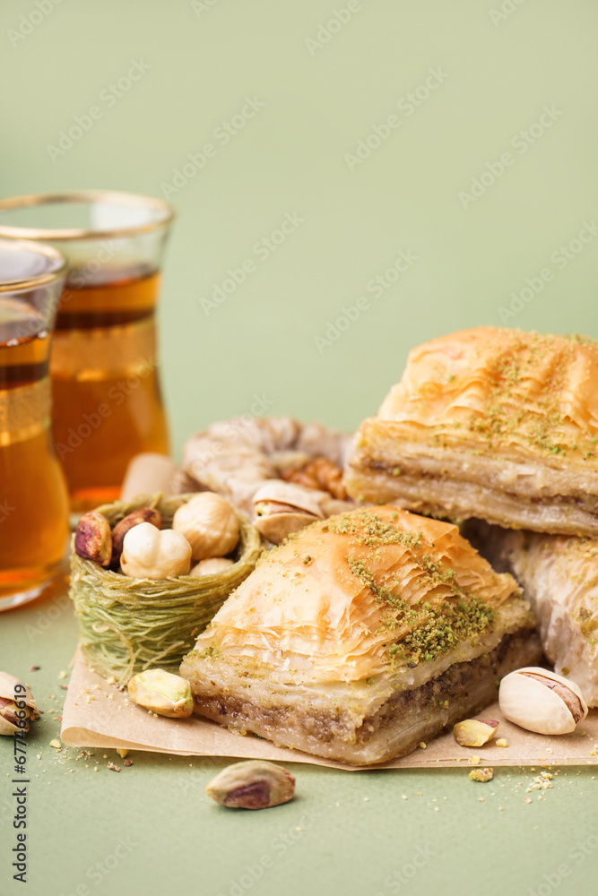 Tasty baklava on green background