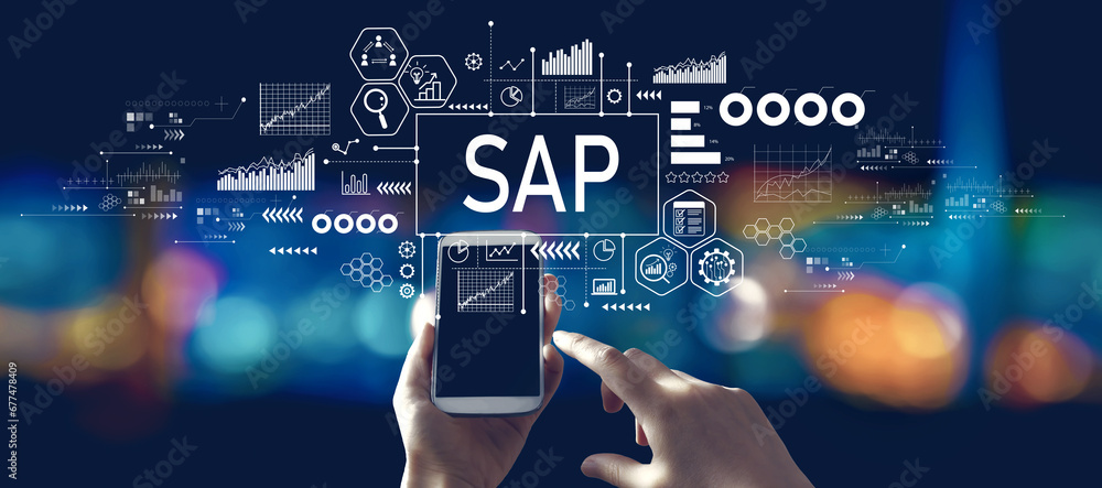 SAP - Business process automation software theme with person using a smartphone in a city at night