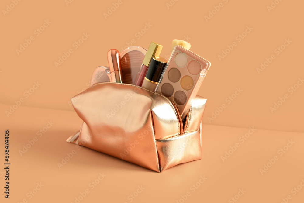 Bag with decorative cosmetics on orange background