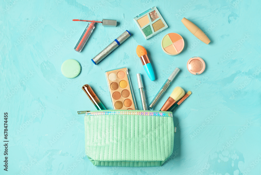 Bag with decorative cosmetics on blue background