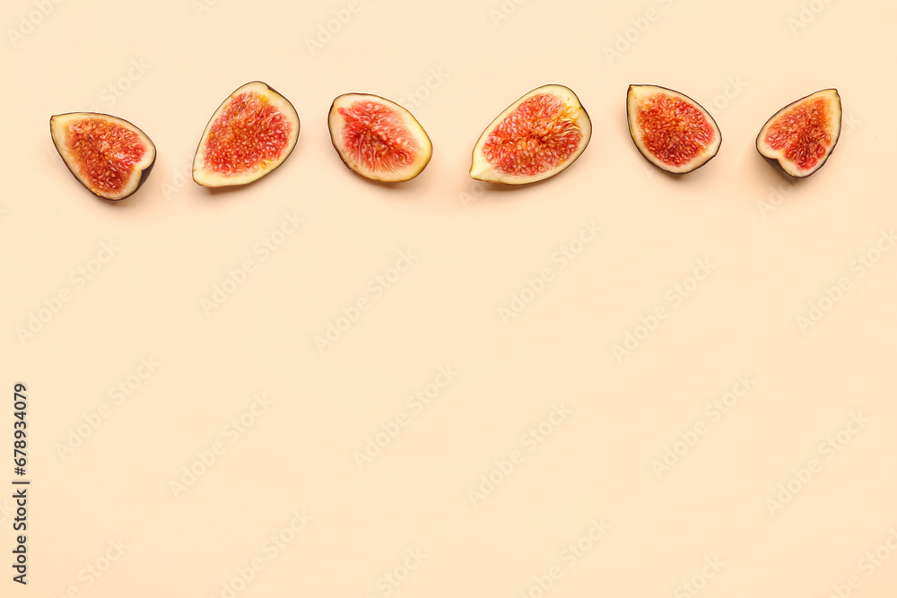 Pieces of fresh ripe figs on orange background