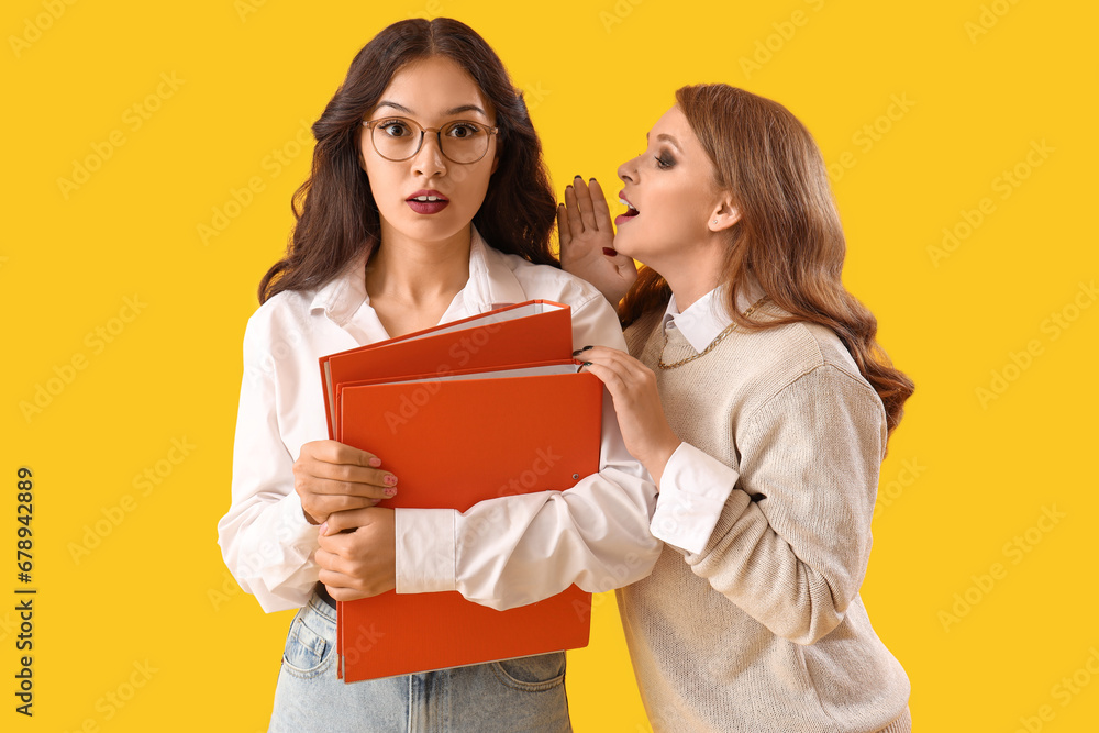 Business colleagues gossiping on yellow background