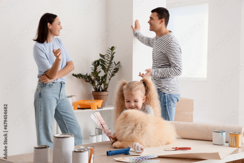 Little girl with dog during repair of her new house