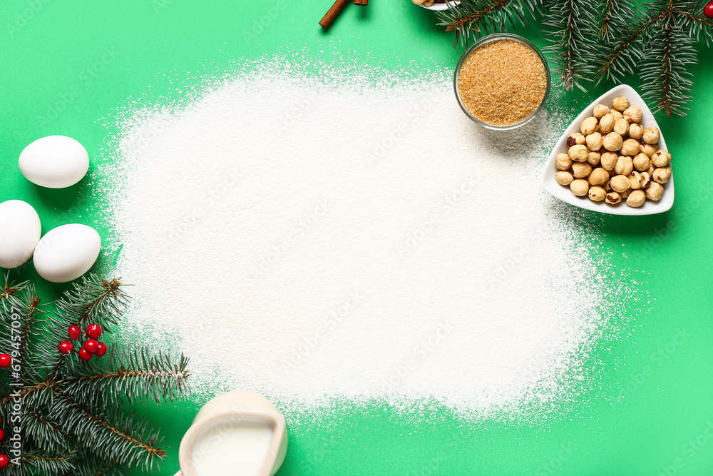 Beautiful composition with different ingredients for preparing Christmas pie on green background