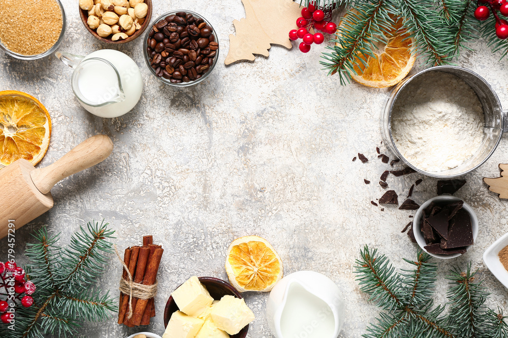 Frame made of different ingredients for preparing Christmas pie and fir branches on grey background