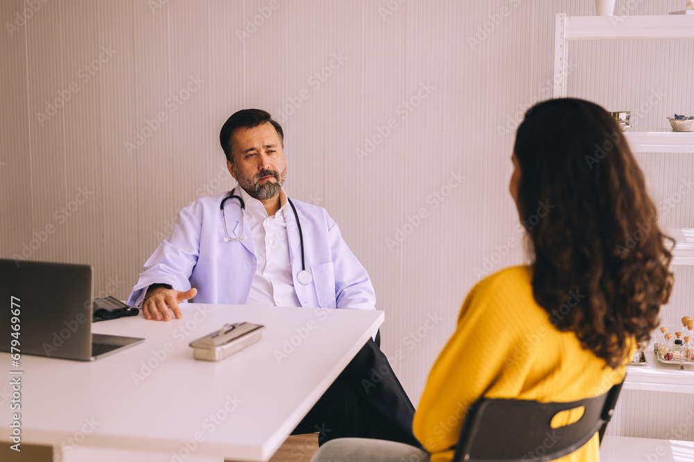 Serious doctor consulting woman and showing her test results on digital tablet, healthcare and medical concept, copy space