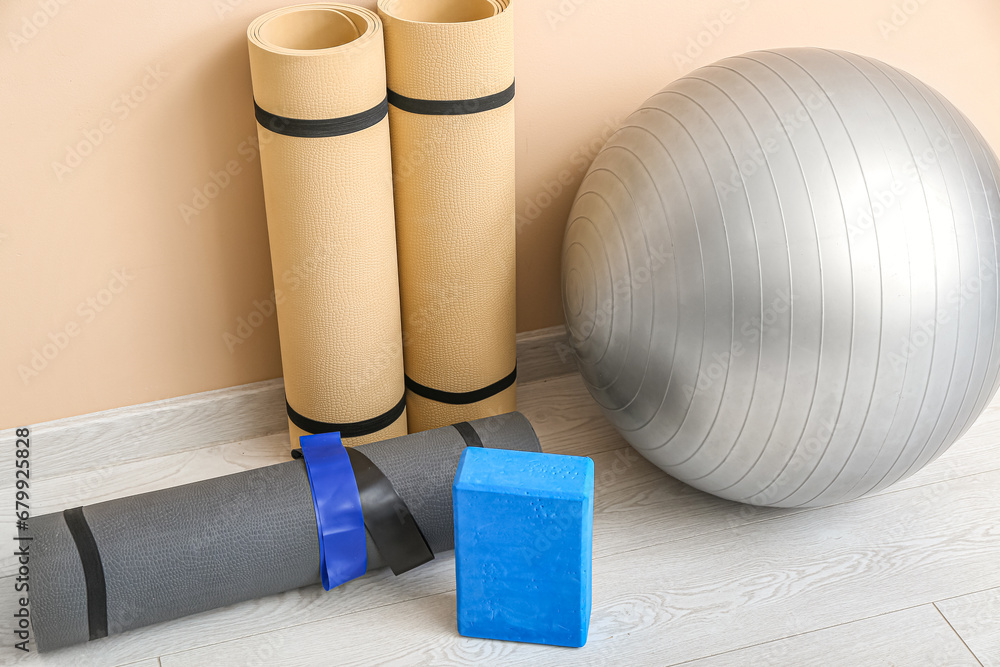 Different fitness equipment on floor in gym