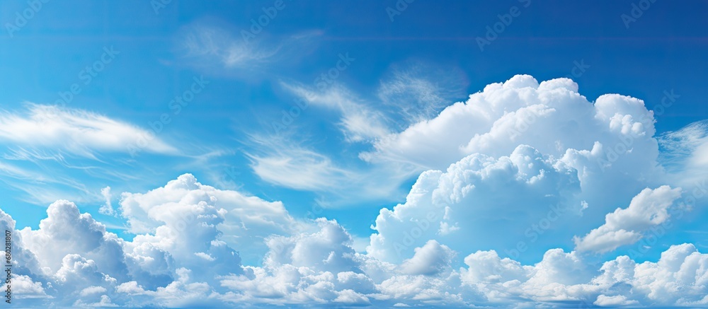 background, the sky exhibited the marvels of nature a splendid canvas of light and white clouds, enhancing the beauty of the blue expanse on a beautiful, bright and cloudy day, as the air felt