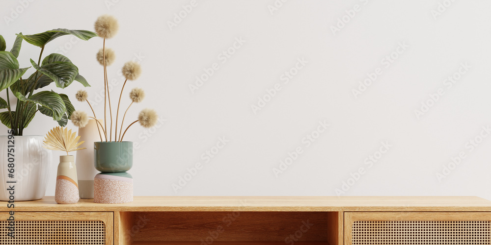 Wooden cabinet and accessories decor in living room interior on empty white wall background