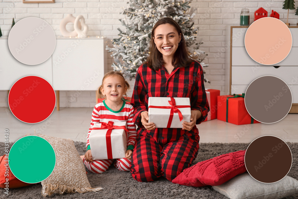 Happy mother and her little daughter with Christmas gifts at home