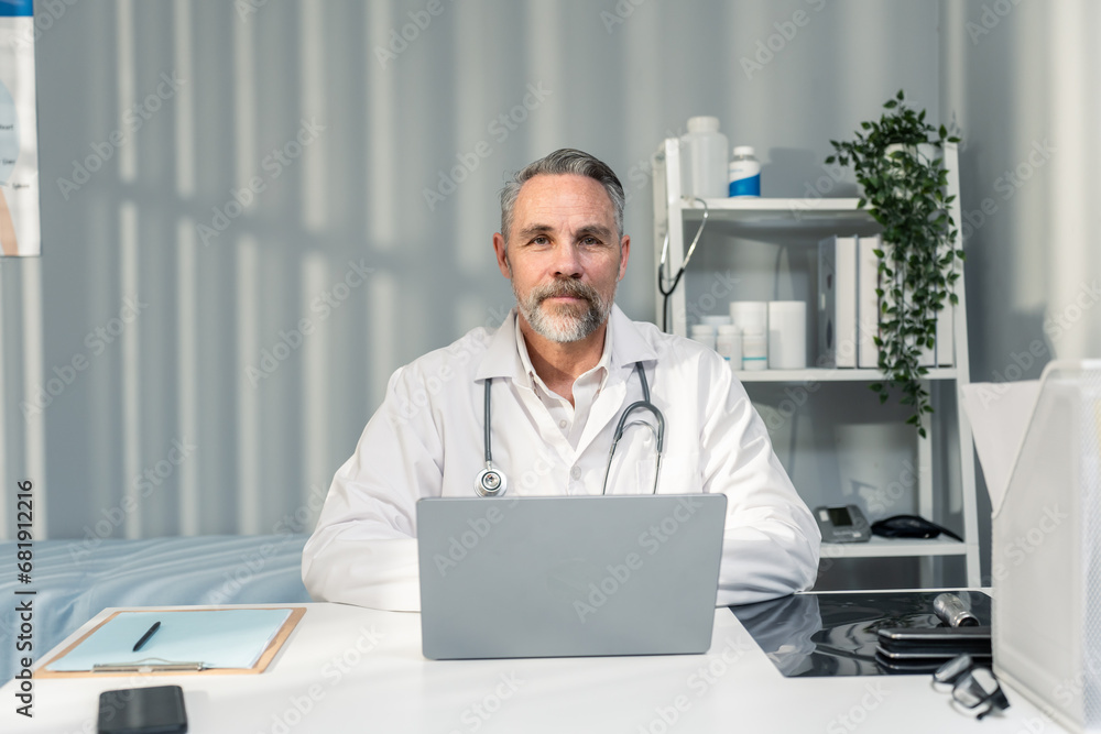 Portrait of Caucasian male doctor talking virtual online with patient. 