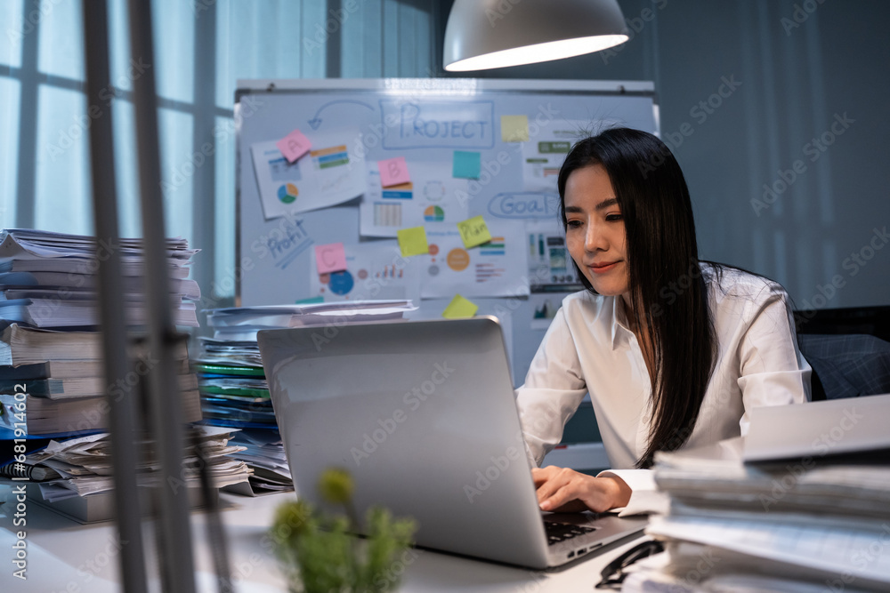 Asian beautiful businesswoman using laptop computer working in office. 