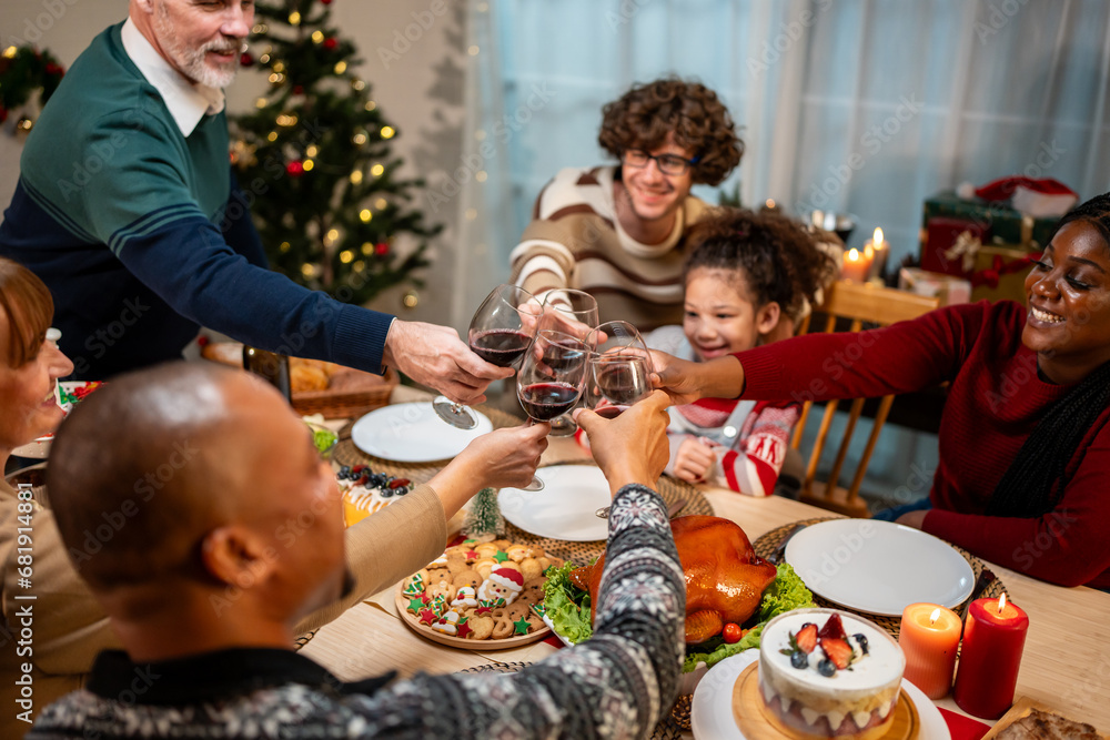 Multi-ethnic big family celebrate Christmas party together in house. 