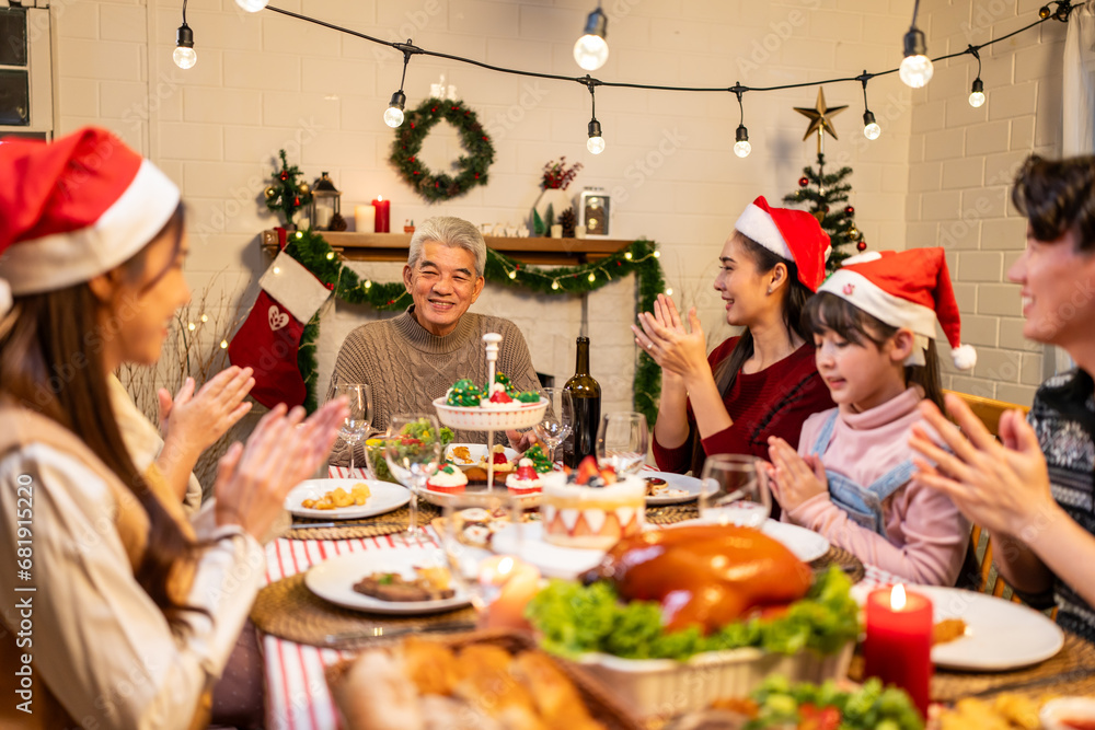 Asian lovely family celebrating Christmas party together in house. 