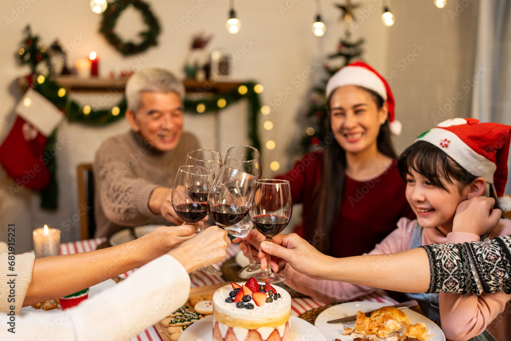 Asian lovely family celebrating Christmas party together in house. 